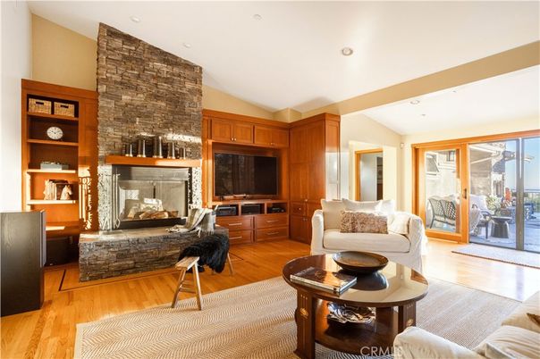 Fireplace, Interior, Living room, Recessed Lighting, Stone Walls, Wood Texture Flooring