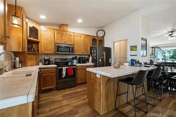 Interior, Kitchen, Recessed Lighting, Tile Countertops, Wood Texture Flooring