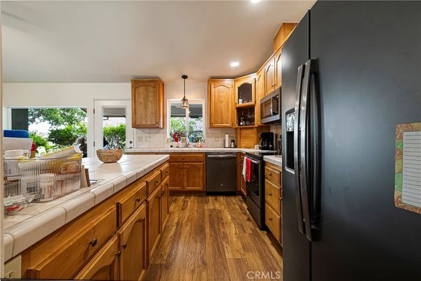 Interior, Kitchen, Pendant Lights, Recessed Lighting, Tile Countertops, Wood Texture Flooring