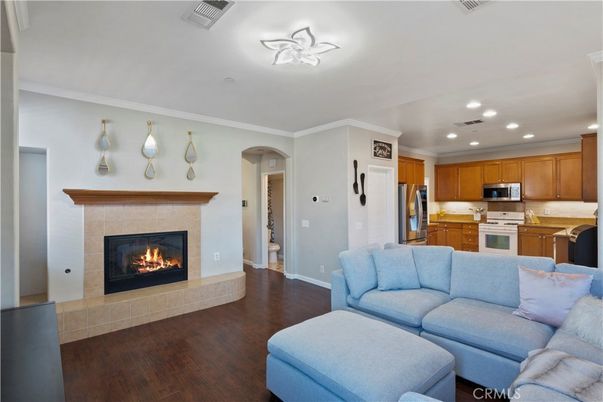 Fireplace, Interior, Kitchen, Living room, Recessed Lighting, Stainless Steel Appliances, Wood Texture Flooring