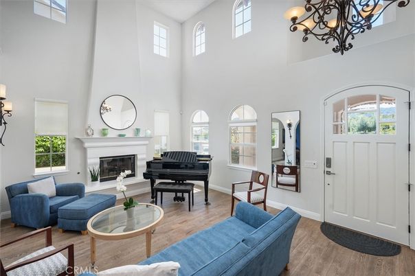 Chandelier, Fireplace, Interior, Living room, Piano, Wood Texture Flooring