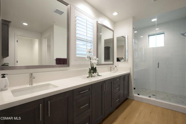 Bathroom, Dual Sink Vanities, Glass Shower, Interior, Recessed Lighting, Wood Texture Flooring