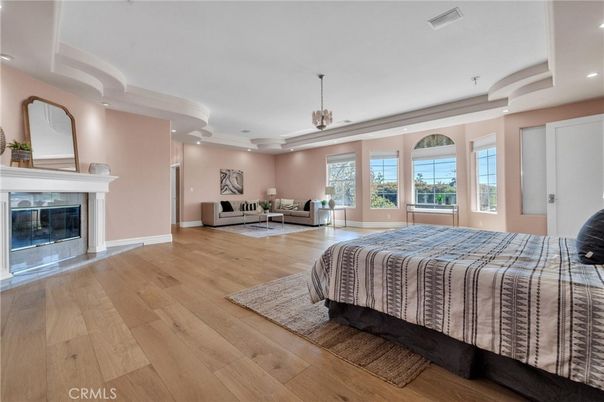 Bedroom, Fireplace, Interior, Pendant Lights, Recessed Lighting, Wood Texture Flooring