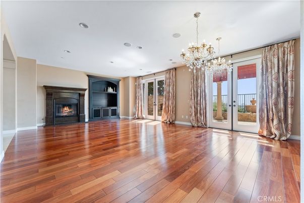 Chandelier, Empty room, Fireplace, Interior, Recessed Lighting, Wood Texture Flooring