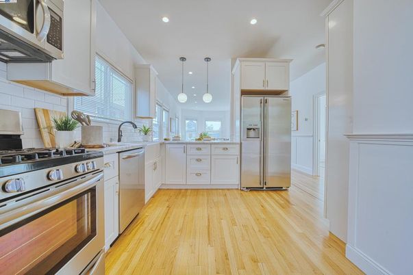 Interior, Kitchen, Pendant Lights, Recessed Lighting, Stainless Steel Appliances, Wood Texture Flooring