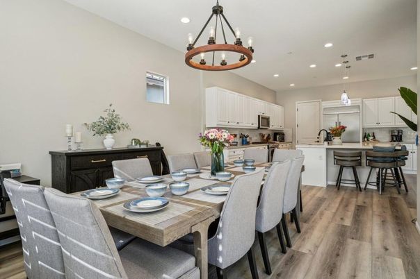 Chandelier, Dining room, Interior, Kitchen, Pendant Lights, Recessed Lighting, Stainless Steel Appliances, Wood Texture Flooring