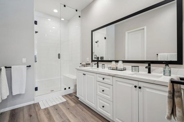 Bathroom, Dual Sink Vanities, Glass Shower, Interior, Recessed Lighting, Wood Texture Flooring