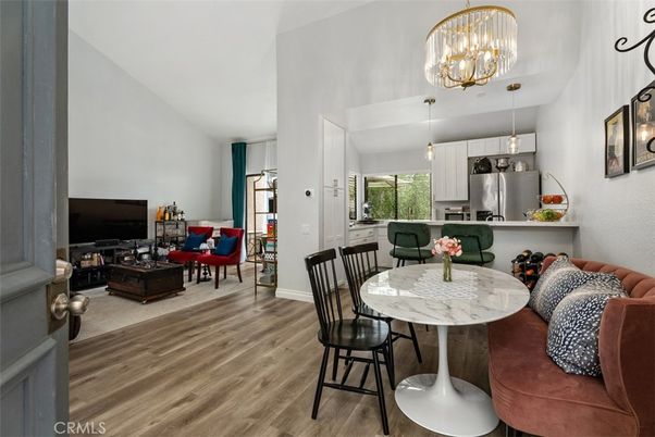 Chandelier, Dining room, Interior, Kitchen, Living room, Pendant Lights, Stainless Steel Appliances, Wood Texture Flooring