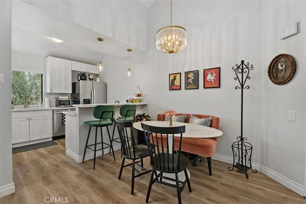 Chandelier, Dining room, Interior, Kitchen, Pendant Lights, Recessed Lighting, Stainless Steel Appliances, Wood Texture Flooring