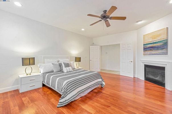 Bedroom, Fireplace, Interior, Recessed Lighting, Wood Texture Flooring