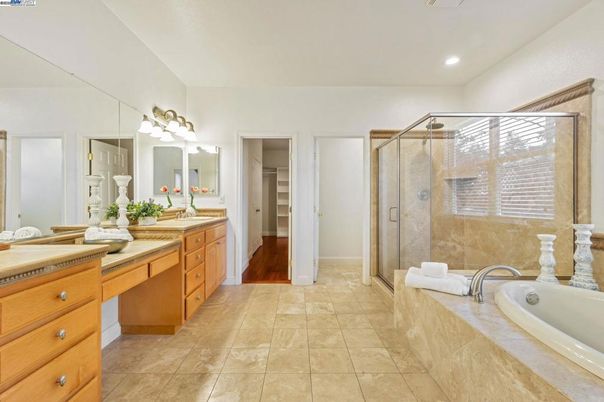 Bathroom, Dual Sink Vanities, Glass Shower, Interior, Recessed Lighting, Wood Texture Flooring