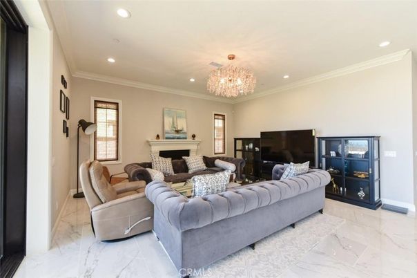 Chandelier, Fireplace, Interior, Living room, Marble, Recessed Lighting