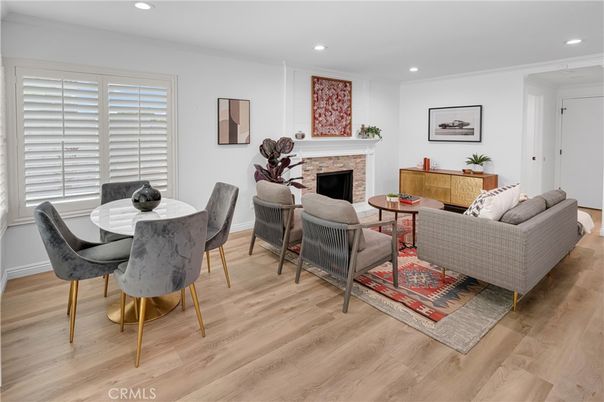 Dining room, Fireplace, Interior, Living room, Recessed Lighting, Wood Texture Flooring