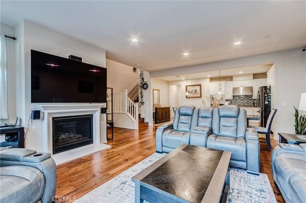 Fireplace, Interior, Kitchen, Living room, Pendant Lights, Recessed Lighting, Stainless Steel Appliances, Wood Texture Flooring