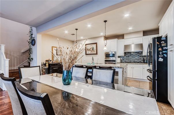 Dining room, Interior, Kitchen, Pendant Lights, Recessed Lighting, Stainless Steel Appliances, Wood Texture Flooring