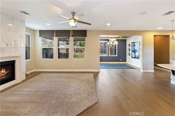 Empty room, Fireplace, Interior, Marble Walls, Pendant Lights, Recessed Lighting, Wood Texture Flooring