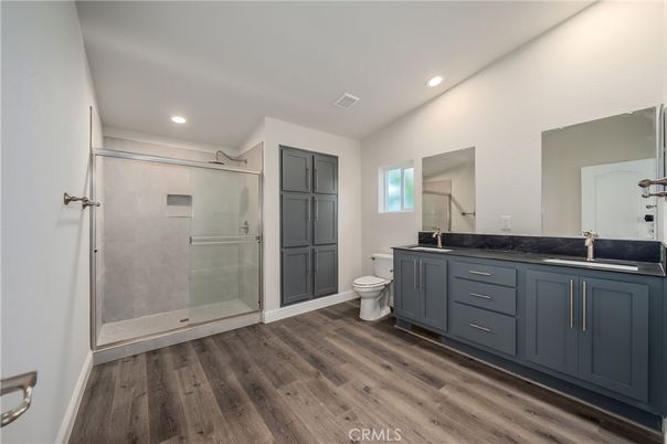 Bathroom, Dual Sink Vanities, Glass Shower, Interior, Recessed Lighting, Wood Texture Flooring