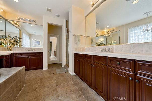 Bathroom, Dual Sink Vanities, Interior, Pendant Lights, Recessed Lighting, Tile Countertops