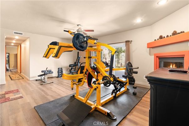Fireplace, Fitness Equipment, Interior, Recessed Lighting, Wood Texture Flooring