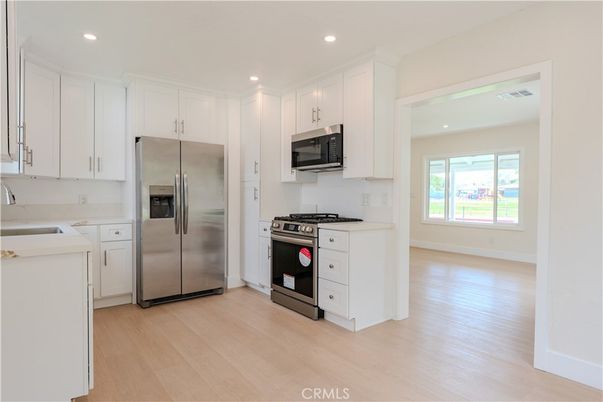 Interior, Kitchen, Recessed Lighting, Stainless Steel Appliances, Wood Texture Flooring