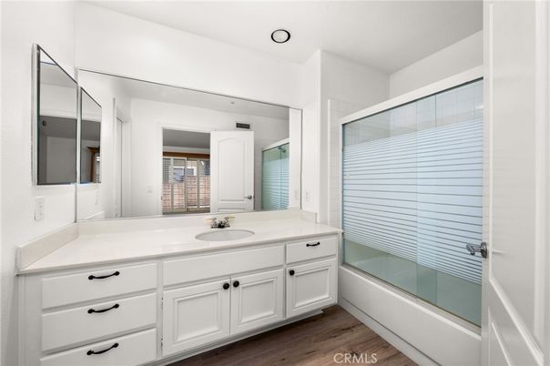 Bathroom, Dual Sink Vanities, Glass Shower, Interior, Recessed Lighting, Wood Texture Flooring
