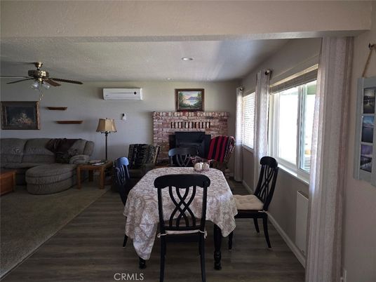 Dining room, Fireplace, Interior, Living room, Recessed Lighting, Wood Texture Flooring