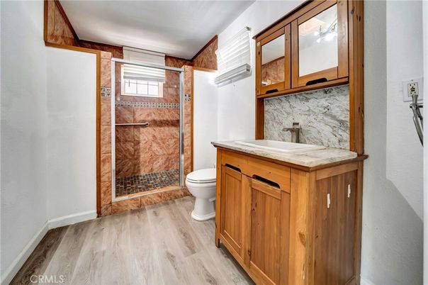 Bathroom, Glass Shower, Interior, Marble Walls, Wood Texture Flooring