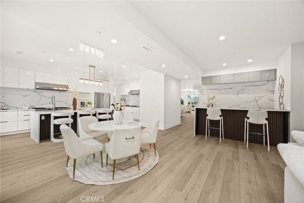 Dining room, Interior, Kitchen, Marble Walls, Pendant Lights, Recessed Lighting, Stainless Steel Appliances, Wood Texture Flooring