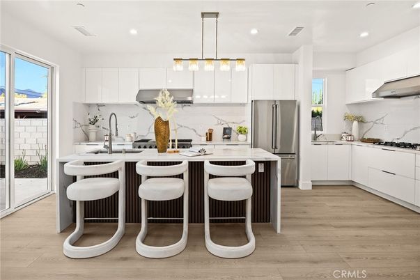 Interior, Kitchen, Marble Walls, Pendant Lights, Recessed Lighting, Stainless Steel Appliances, Wood Texture Flooring