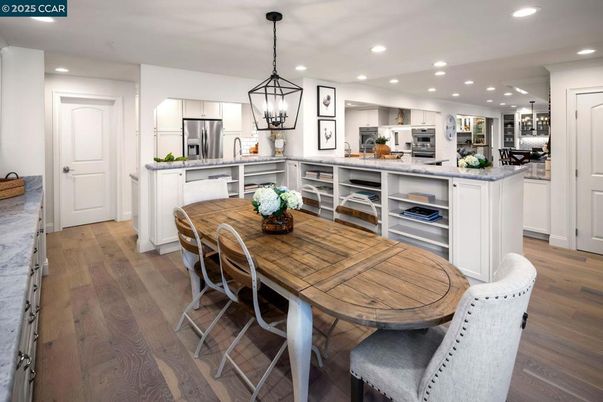 Dining room, Interior, Kitchen, Pendant Lights, Recessed Lighting, Stainless Steel Appliances, Wood Texture Flooring