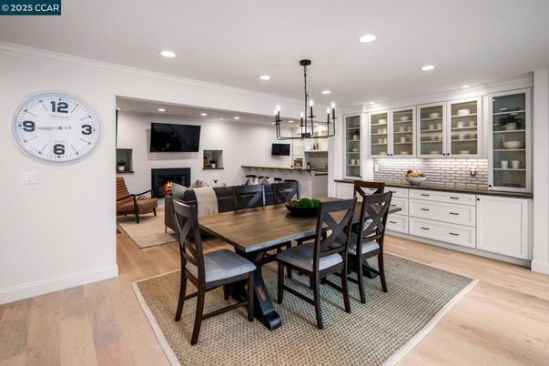 Dining room, Fireplace, Interior, Living room, Pendant Lights, Recessed Lighting, Wood Texture Flooring