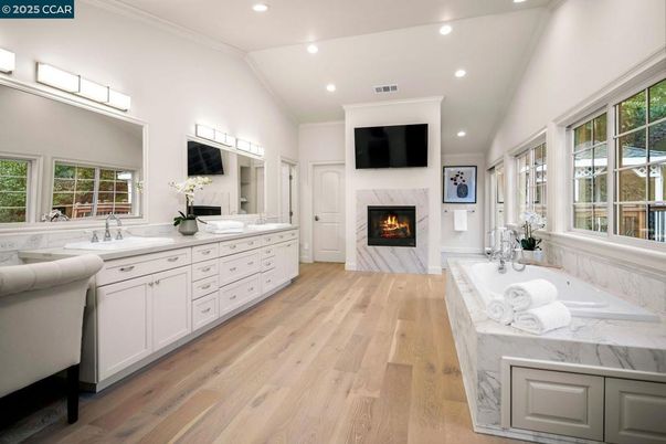 Bathroom, Dual Sink Vanities, Fireplace, Interior, Recessed Lighting, Wood Texture Flooring