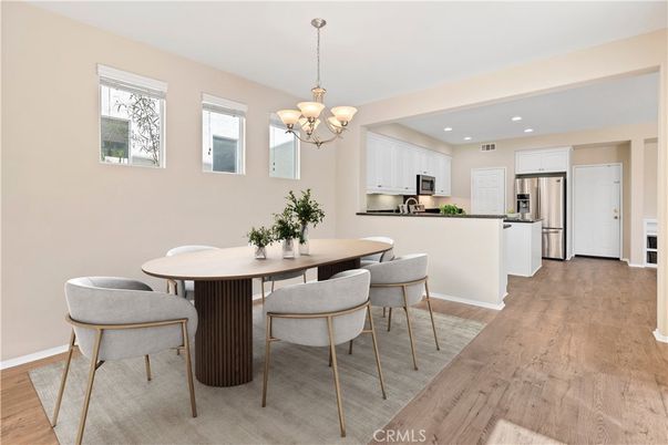 Chandelier, Dining room, Interior, Kitchen, Recessed Lighting, Stainless Steel Appliances, Wood Texture Flooring