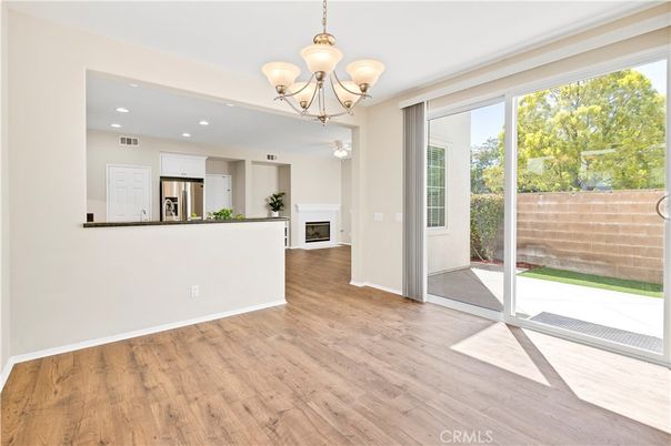 Chandelier, Empty room, Interior, Kitchen, Recessed Lighting, Stainless Steel Appliances, Wood Texture Flooring