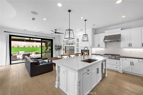 Dining room, Fireplace, Interior, Kitchen, Living room, Pendant Lights, Recessed Lighting, Stainless Steel Appliances, Wood Texture Flooring