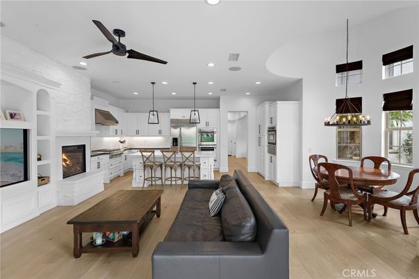 Dining room, Fireplace, Interior, Kitchen, Living room, Pendant Lights, Recessed Lighting, Stainless Steel Appliances, Wood Texture Flooring