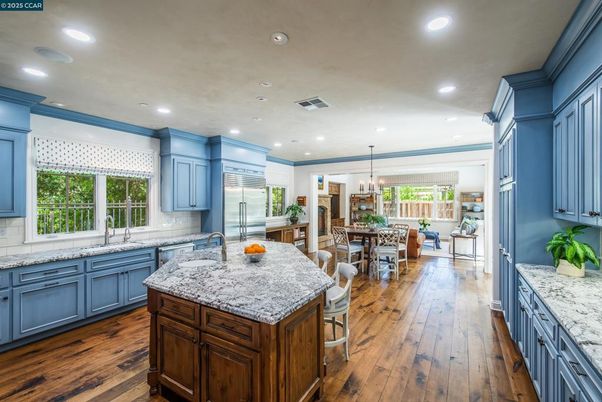 Chandelier, Dining room, Interior, Kitchen, Recessed Lighting, Stainless Steel Appliances, Wood Texture Flooring