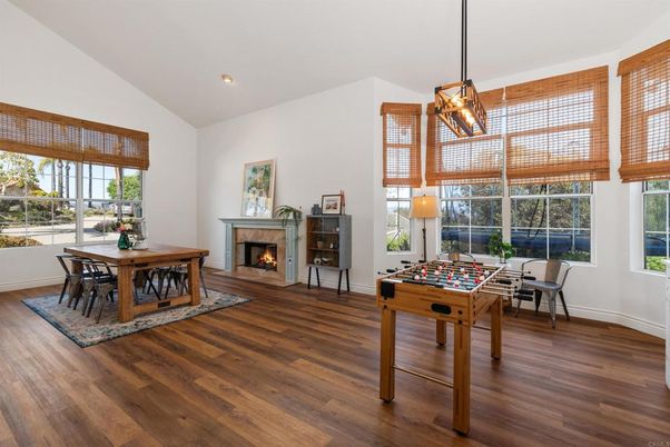 Dining room, Fireplace, Game Room, Interior, Pendant Lights, Recessed Lighting, Wood Texture Flooring