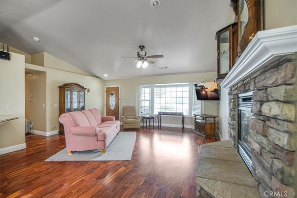 Fireplace, Interior, Living room, Recessed Lighting, Stone Walls, Wood Texture Flooring