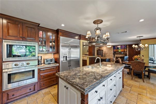 Chandelier, Dining room, Interior, Kitchen, Recessed Lighting, Stainless Steel Appliances, Stone Walls