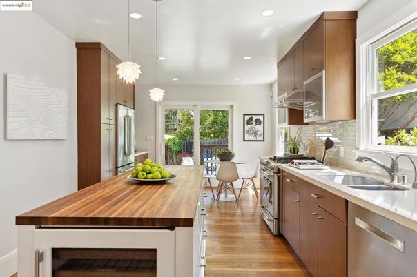 Dining room, Interior, Kitchen, Pendant Lights, Recessed Lighting, Stainless Steel Appliances, Wood Texture Flooring