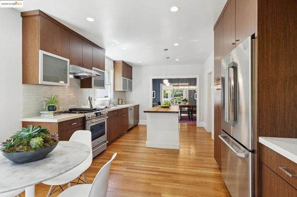 Dining room, Interior, Kitchen, Pendant Lights, Recessed Lighting, Stainless Steel Appliances, Wood Texture Flooring