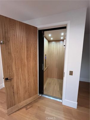 Elevator, Interior, Recessed Lighting, Wood Texture Flooring, Wooden Walls