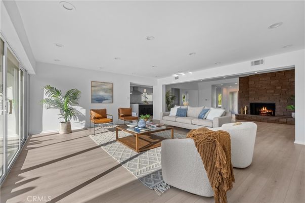 Fireplace, Interior, Living room, Recessed Lighting, Stone Walls, Wood Texture Flooring