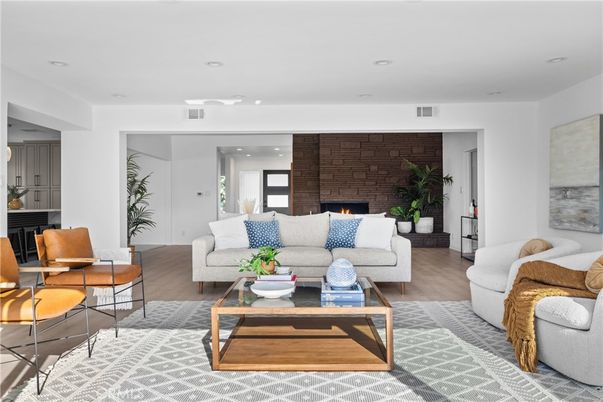 Fireplace, Interior, Living room, Recessed Lighting, Stone Walls, Wood Texture Flooring