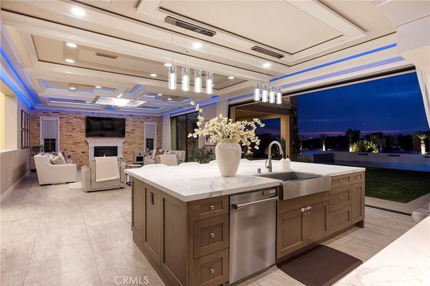 Fireplace, Interior, Kitchen, Living room, Pendant Lights, Recessed Lighting, Stainless Steel Appliances, Stone Walls