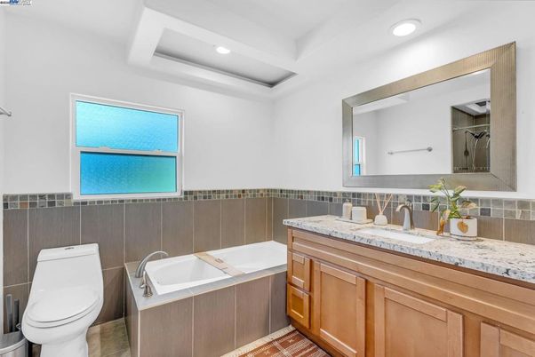 Bathroom, Dual Sink Vanities, Interior, Recessed Lighting, Tile Countertops