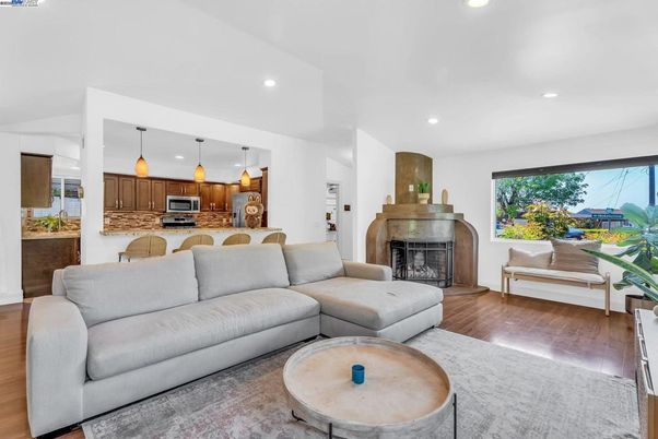 Fireplace, Interior, Kitchen, Living room, Pendant Lights, Recessed Lighting, Stainless Steel Appliances, Wood Texture Flooring