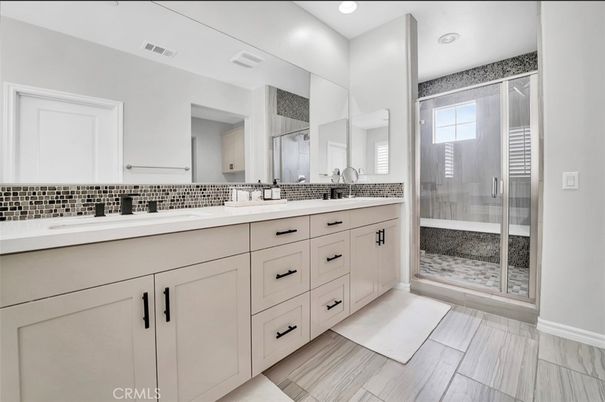 Bathroom, Dual Sink Vanities, Glass Shower, Interior, Recessed Lighting, Wood Texture Flooring