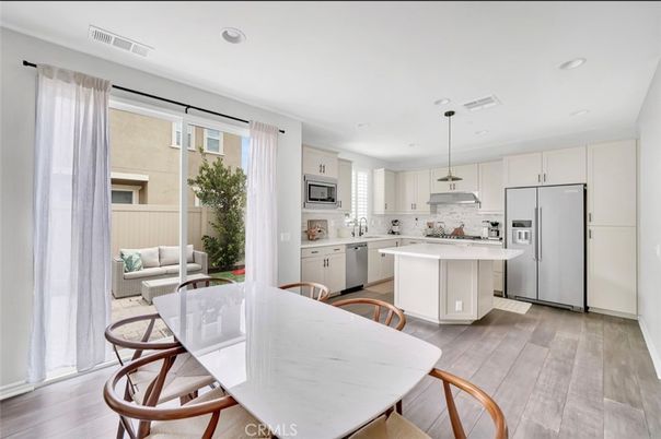 Dining room, Interior, Kitchen, Pendant Lights, Recessed Lighting, Stainless Steel Appliances, Wood Texture Flooring